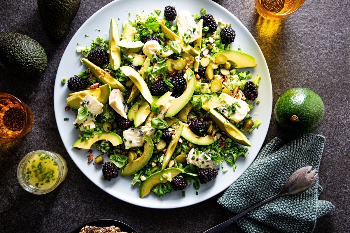 Avocado salad with broccoli, almonds, blue cheese and blackberries